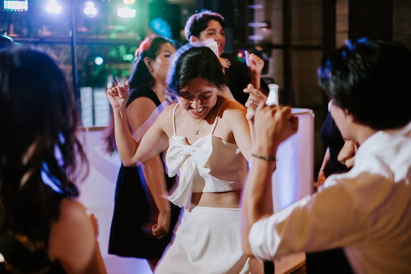 Wedding guests dancing on a packed dance floor