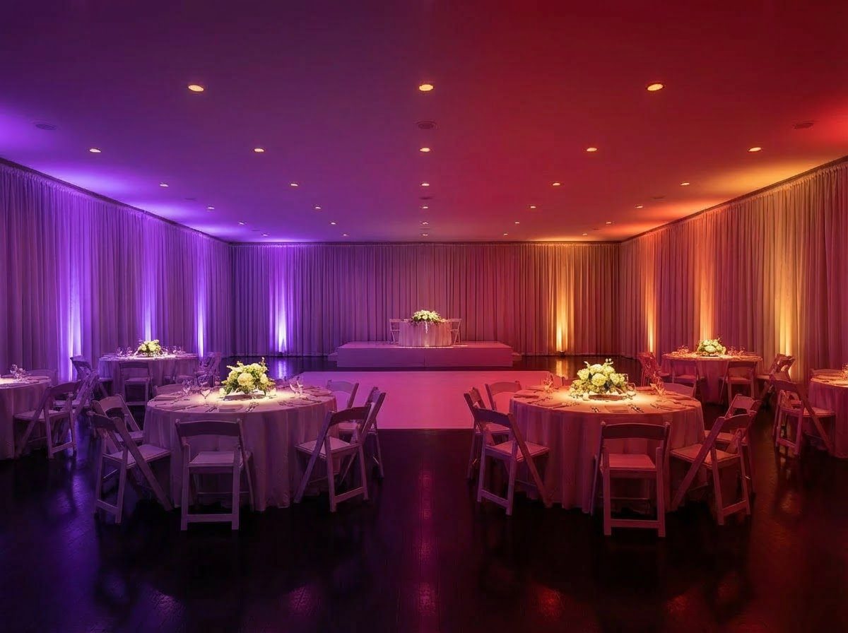 Ballroom after ambient uplighting — transformed with purple and gold