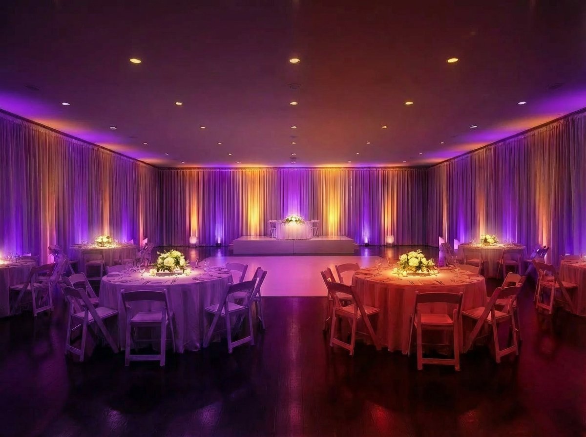 Full venue transformed with ambient uplighting across the room and dancefloor