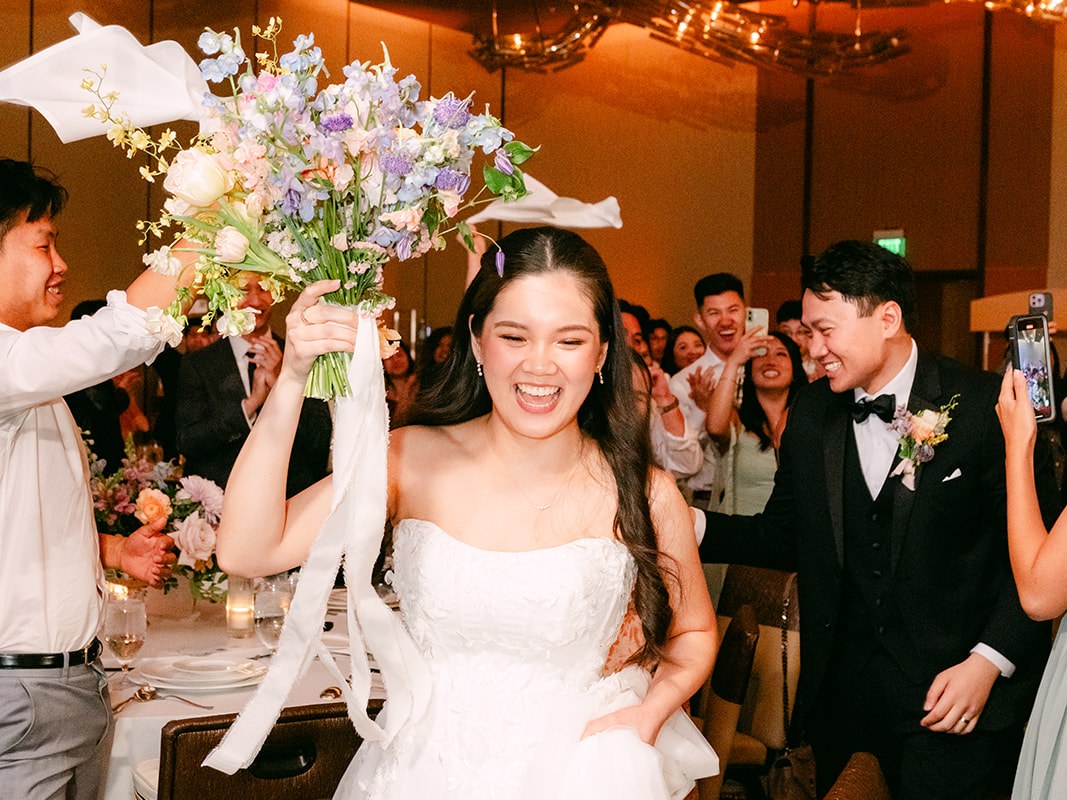 Newlyweds introduced to their reception as guests cheer