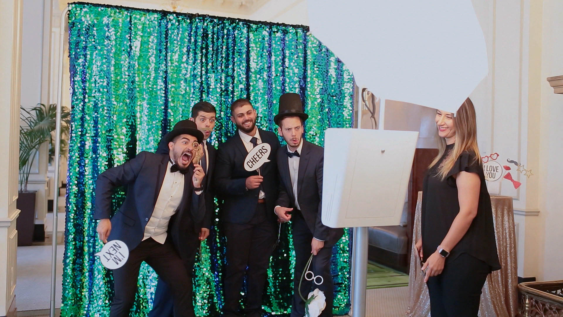 Photobooth attendant assisting guests at an event